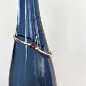 Sterling silver beaded stretch bangle w/ garnet bead